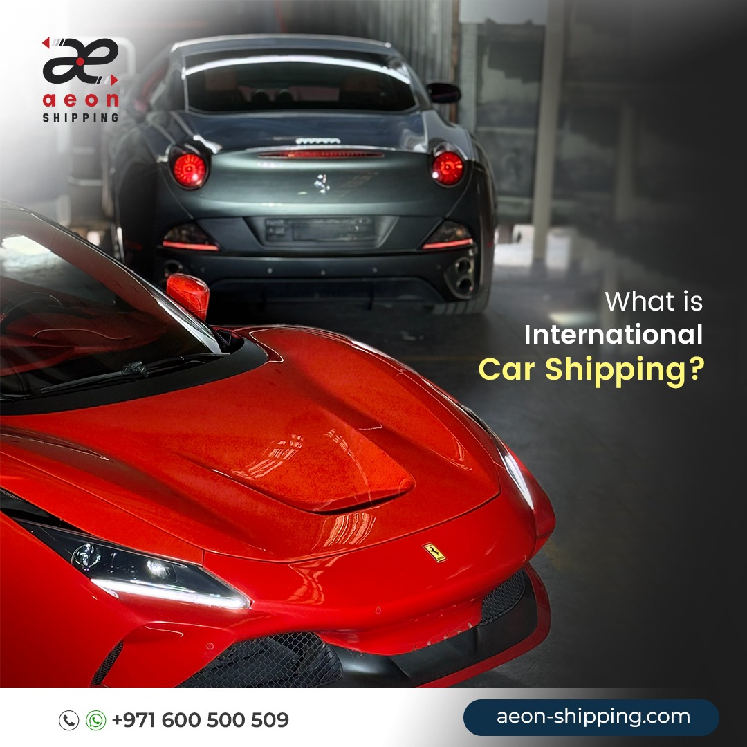 A close-up of a vibrant red Ferrari in the foreground, with the rear of a dark grey Ferrari visible in the background inside a warehouse or garage. The top-left corner features the "Aeon Shipping" logo. On the right, white and yellow text asks, "What is International Car Shipping?". The bottom of the image includes a phone icon, a WhatsApp icon with the number +971 600 500 509, and the website URL aeon-shipping.com.